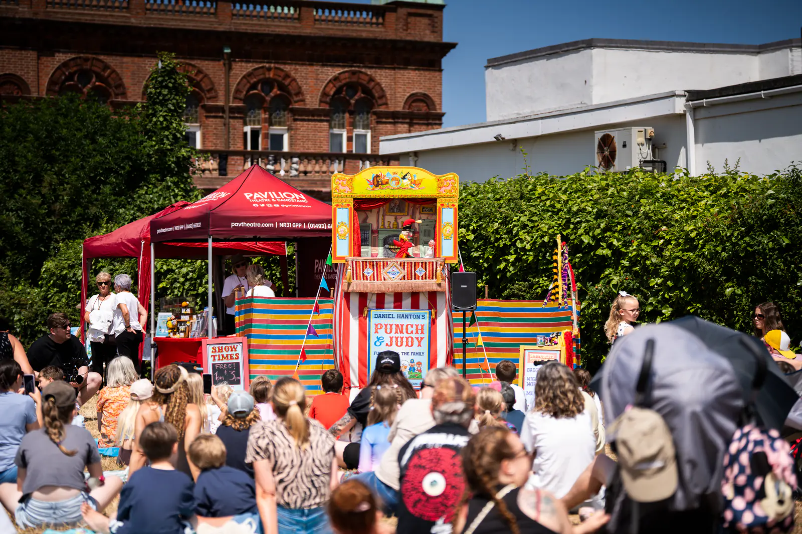Families gathered for a Punch and Judy show during the birthday celebration
