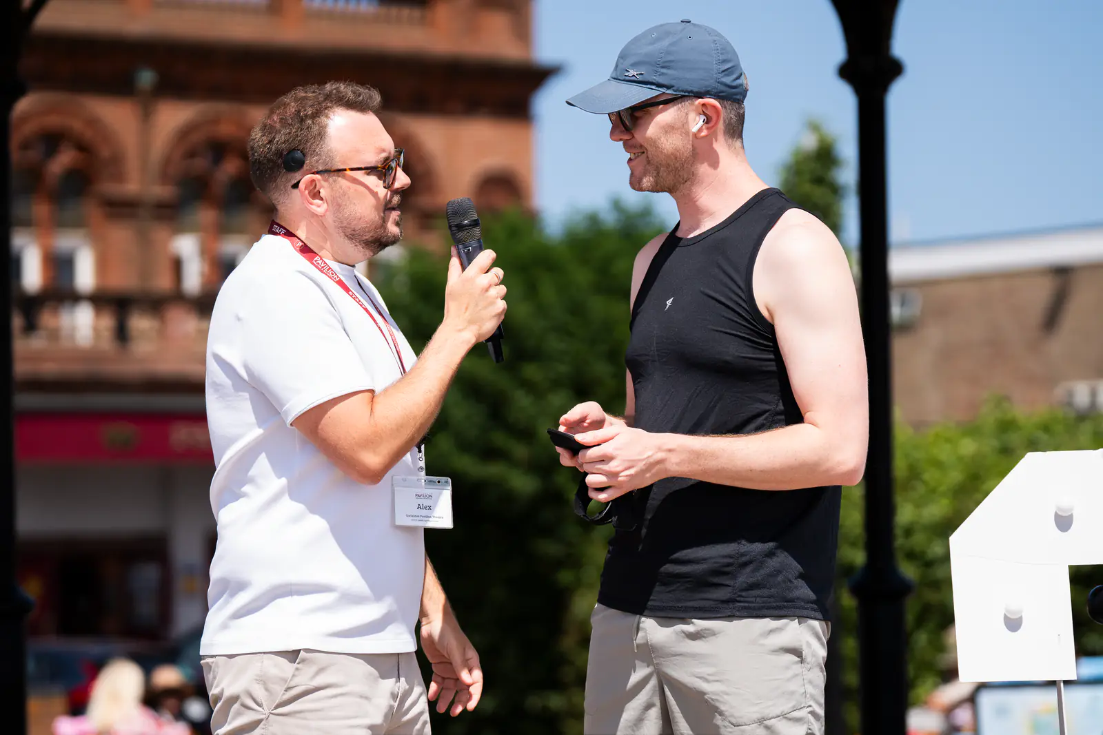 Two members of the Pavilion team talking on the bandstand stage