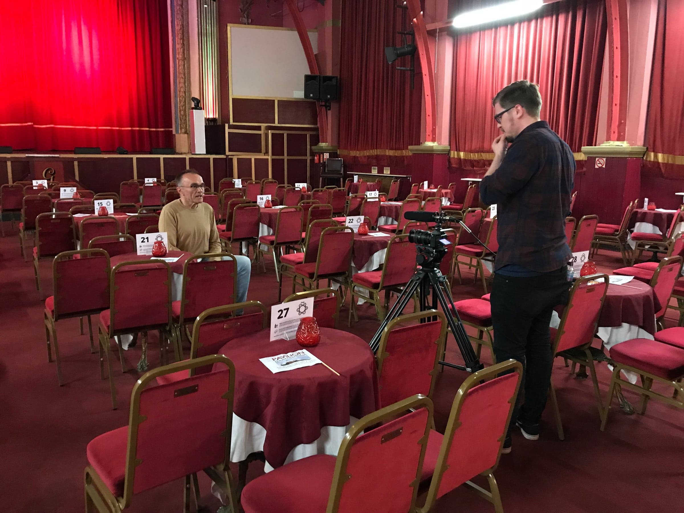 Danny Boyle being filmed during an interview inside the Pavilion auditorium