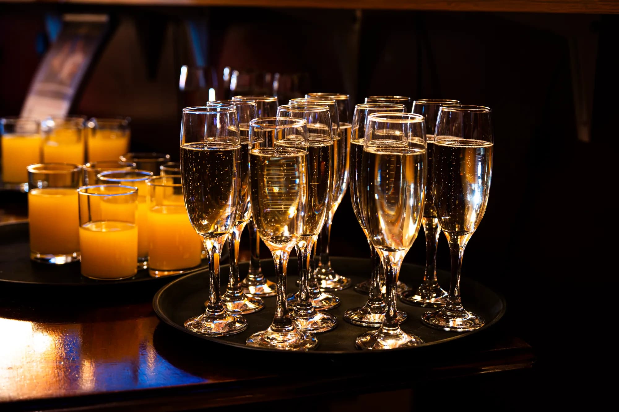 Trays of sparkling wine and orange juice prepared for a private event at the Pavilion