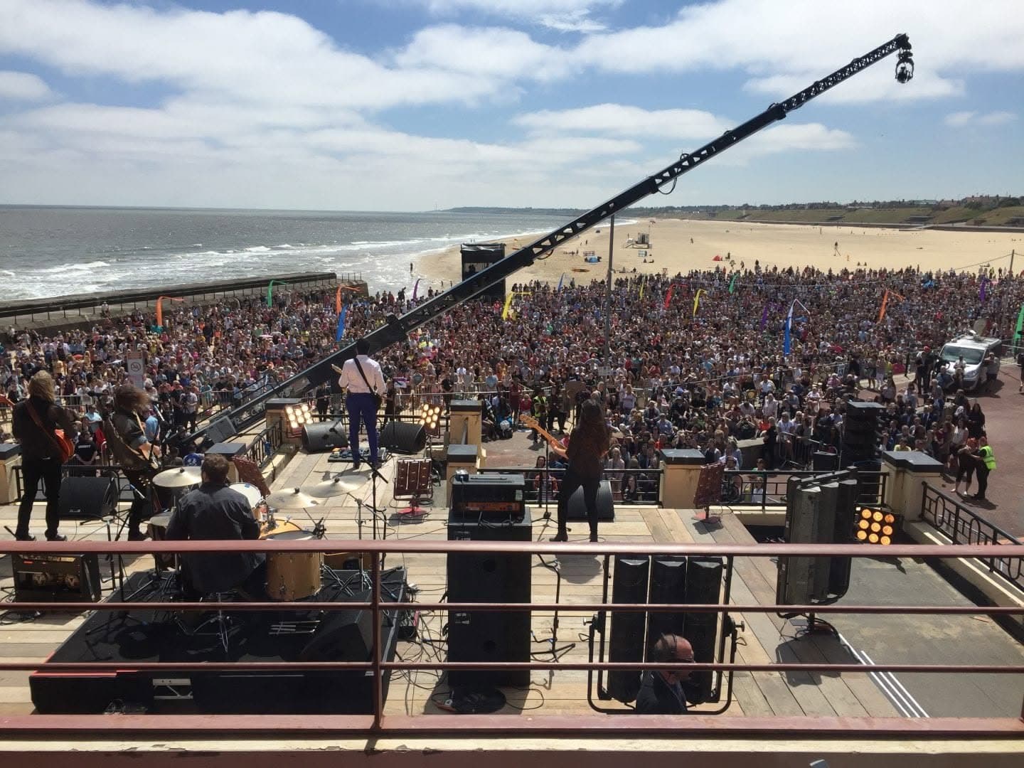 The Yesterday beach concert being filmed in Gorleston with a large crowd and camera crane