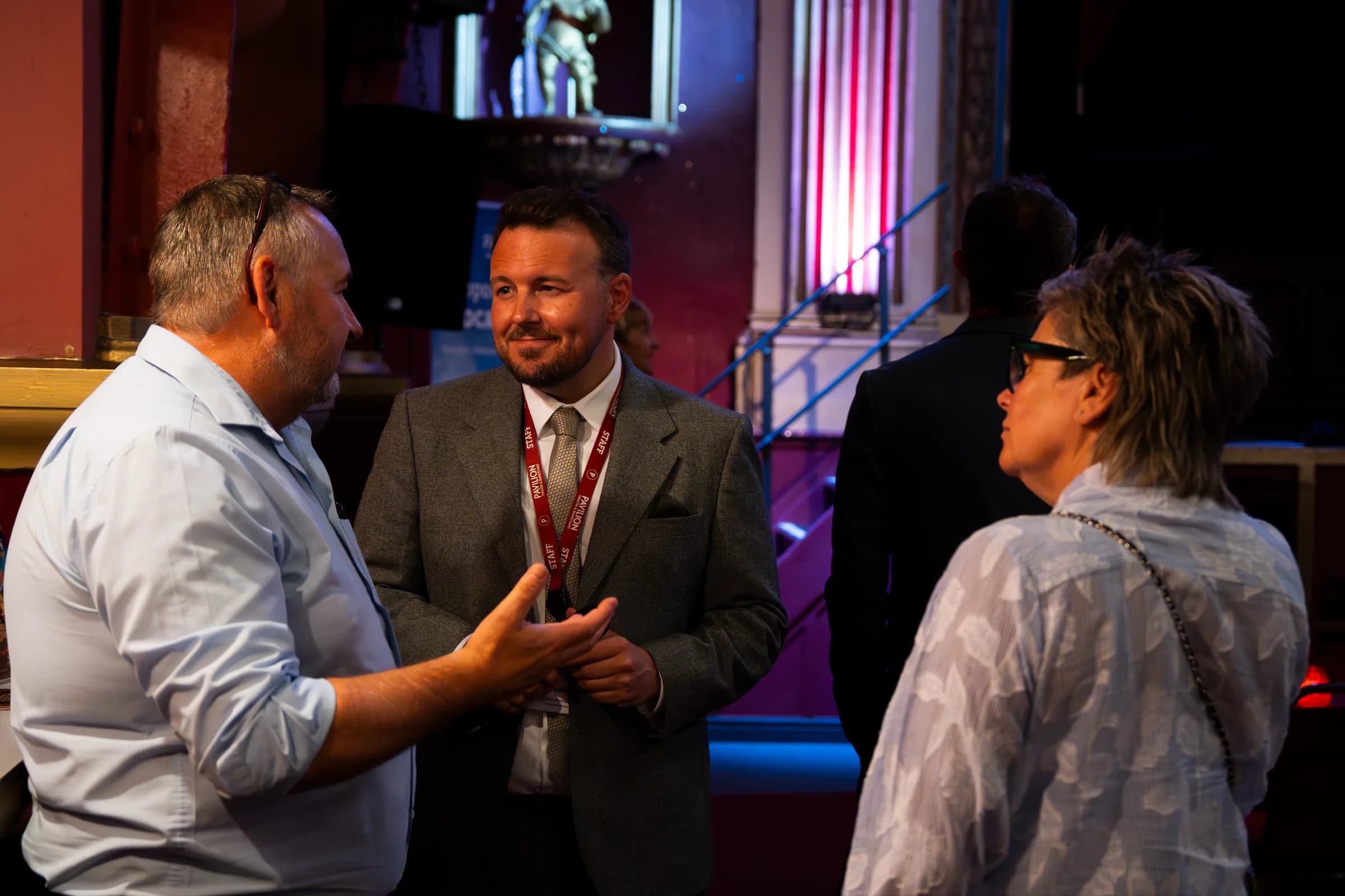 Pavilion Theatre staff talking with guests at a business networking event